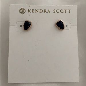 Kendra Scott stud earrings.
